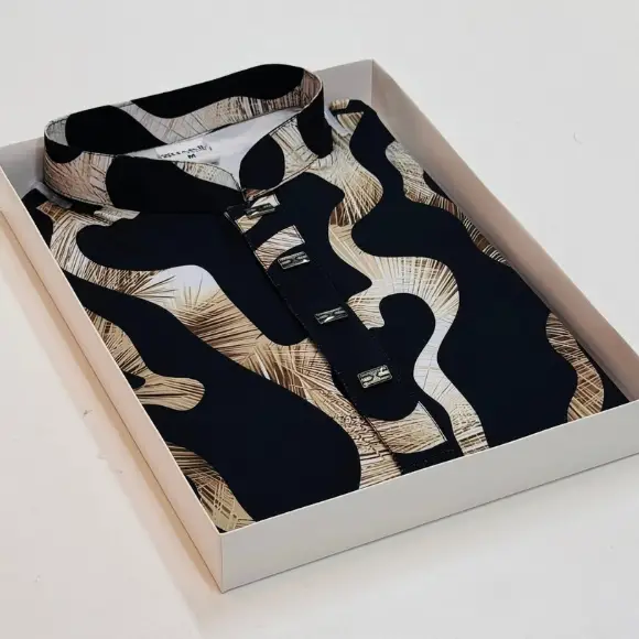 Black China Stretch men's printed panjabi with golden-brown and white abstract wavy pattern design, golden rectangular metal buttons, displayed in a light cream box