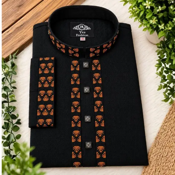 Black Indian Cotton men's panjabi with orange and black geometric pattern embroidered collar and placket, black square metal buttons, displayed on a wooden table